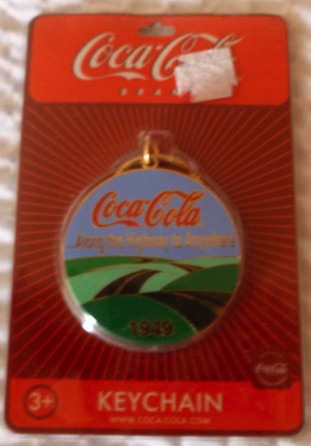 93192-1 € 5,00 coca cola sleutelhanger ijzer rond.jpeg
